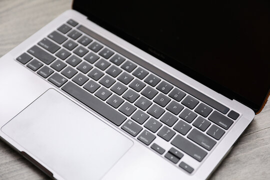 modern computer keyboard bathed in soft, diffused light, resting on a sleek desk. A symbol of productivity and connectivity, it invites creativity in the digital age - Powered by Adobe