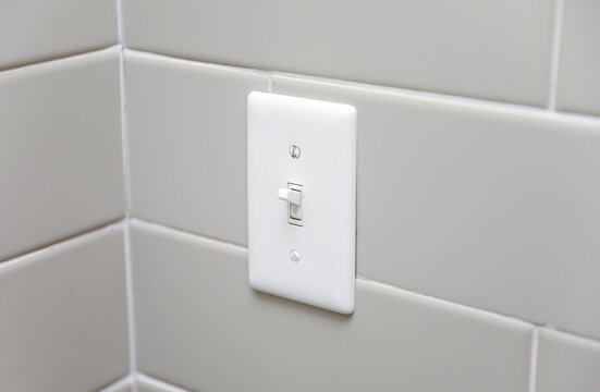 light switch in a dimly lit room, showcasing anticipation, connection, and the power of choice