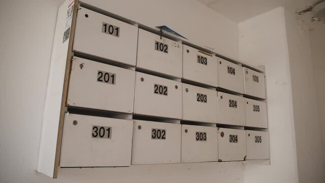 The infinite wall of mailboxes. The correspondence delivery. Loopable. Locked apartment mailboxes
