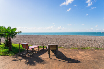 Fototapeta na wymiar Beach chairs by the sea
