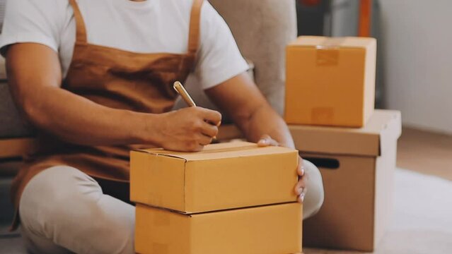 .Young female dress designer sitting at workplace with laptop. Small business owner, entrepreneur, seller checking ecommerce clothing store orders. Shopping concept. Fashion studio.