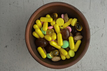 there are various vitamins on the table in a plate