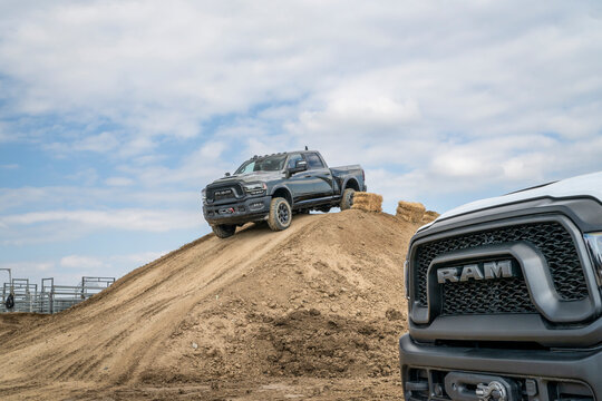 Loveland, CO, USA - August 26, 2023: RAM Rebel trucks on a muddy training off-road trail course.
