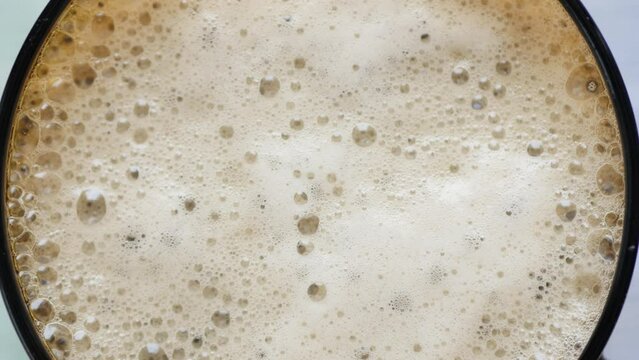 Beer foam texture. 4k video