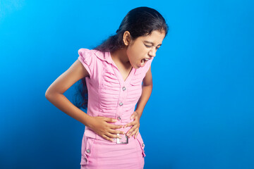 Beautiful Indian girl feeling unwell due to stomachache