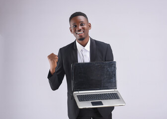 businessman happy excited Handsome happy smiling excited African black man in late 20s isolated on a white background holding laptop PC