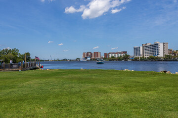 A beautiful summer landscape along Cape Fear river with people waiting for a ferry, an American...