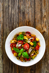 Italian style food - panzanella salad on wooden table
