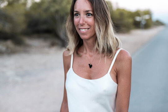 Stylish self-assured modern woman looking away  wearing fashionable springtime clothes 