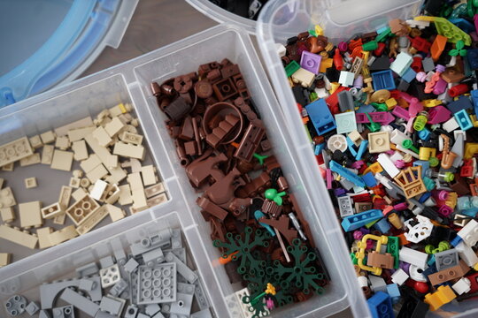 Acrylic boxes, transparent boxs of many legos. lego collectors. organizing containers with colourful legos. 
