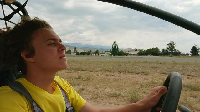 Young man driving off road buggy car.
4wd buggy atv utv adventure. Quad buggy vehicles race. Buggy extreme ride. Cholpon-Ata, Kyrgyzstan.