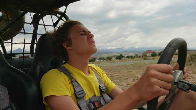 Young man driving off road buggy car.
4wd buggy atv utv adventure. Quad buggy vehicles race. Buggy extreme ride. Cholpon-Ata, Kyrgyzstan.