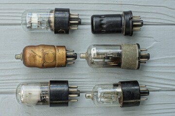 six  different whole glass retro electric historical vacuum radio tubes with metal contacts for an...
