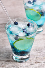 Blue Mojito with blueberries. Cocktails Liquor-based Blue Curacao