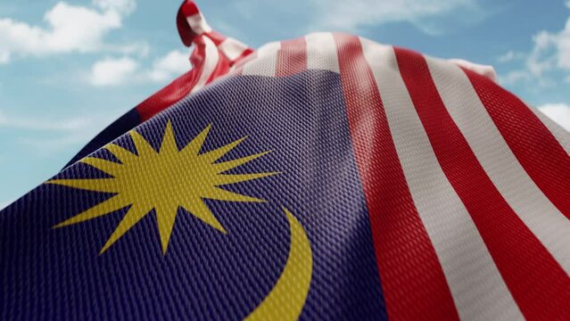 Wavy flag of Malaysia blowing in the wind in slow motion. Waving official Malaysian flag team symbol abstract vertical background. Blue sky with clouds. World countries flying flags concept