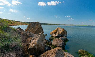 Fototapeta na wymiar Natural landscape, shell stones in the water near the shore of the Khadzhibey estuary