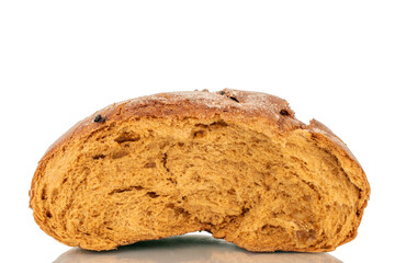 One half of a loaf of bread with raisins, macro, isolated on a white background.
