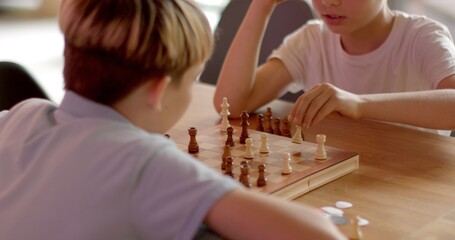 Children Engaging in Chess at School Competitions. Teenagers Brain development no face Move is decision fraught with consequences, requiring to foresee consequences choices, consider tactics opponents - obrazy, fototapety, plakaty