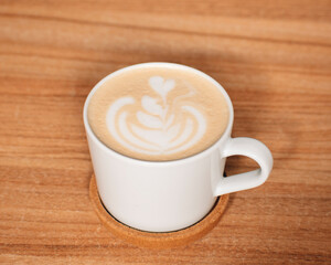 cup of coffee on a wooden table