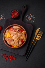 A delicious dish consisting of slices of chicken, sweet peppers and onions