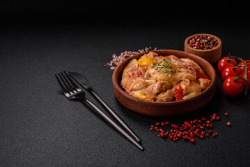 A delicious dish consisting of slices of chicken, sweet peppers and onions
