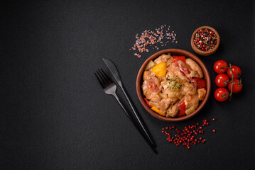 A delicious dish consisting of slices of chicken, sweet peppers and onions