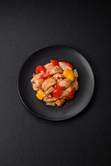 A delicious dish consisting of slices of chicken, sweet peppers and onions