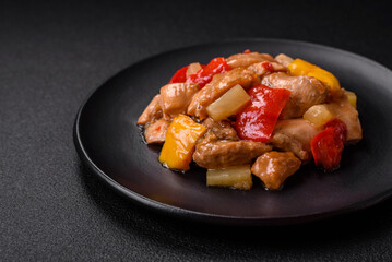 A delicious dish consisting of slices of chicken, sweet peppers and onions
