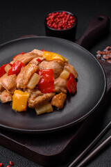 A delicious dish consisting of slices of chicken, sweet peppers and onions