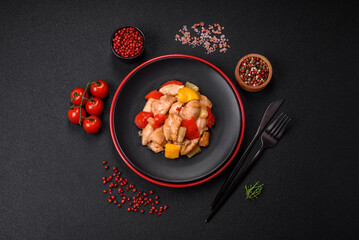 A delicious dish consisting of slices of chicken, sweet peppers and onions