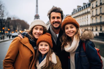Foto op Canvas Portrait of a happy young caucasian family taking a photo in Paris France © Geber86
