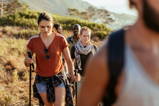 Young and diverse group of people trekking in the mountains of South Africa