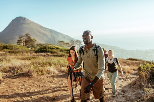 Young and diverse group of people trekking in the mountains of South Africa