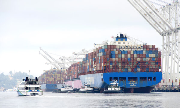 Oakland, CA - Sept 14, 2023: China Shipping Lines (CSCL) Cargo Ship SUMMER docking at the Port of Oakland. CSCL, based in Shanghai, China, it is now the 8th largest container shipping Co.