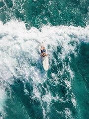 Surfer girl on a wave in Hawaii longboard surfboard