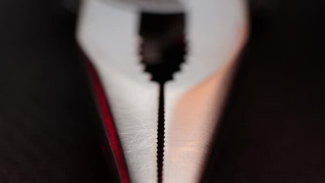 Macro Close up of a multi tool pliers and other pocket tools