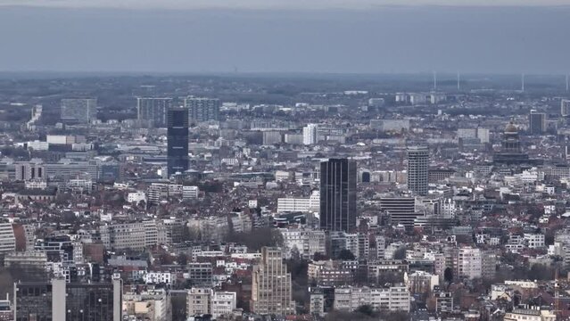 Aerial insights: Brussels' geography, from historic homes to hubs, shines even under clouds.
