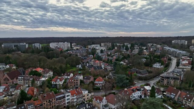 Panoramic aerial shot: Brussels' geography unfolds, from homes to historic landmarks.
