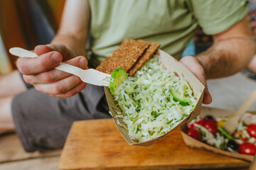 Close-up of young man having healthy lunch