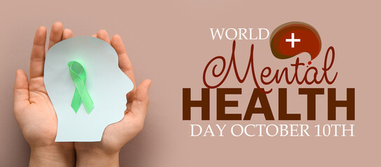 Banner for World Mental Health Day with paper human head and green awareness ribbon