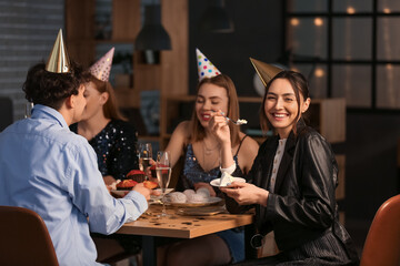 Group of young friends celebrating Birthday at night
