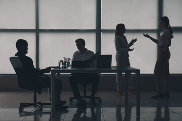 Silhouette of business consultants working in office