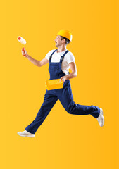 Jumping male decorator on yellow background