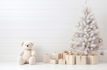 Merry Christmas greeting card with gold balls and white gifts under the tree on wall background with teddy doll. Xmas and happy new year