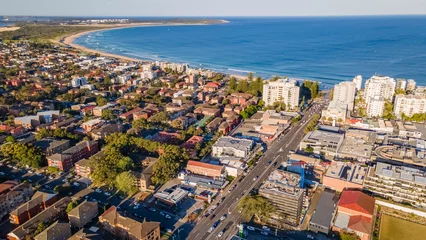 Poster Aerial drone view above Cronulla in the Sutherland Shire, South Sydney, NSW Australia looking in the east direction on a sunny afternoon in September 2023   © Steve