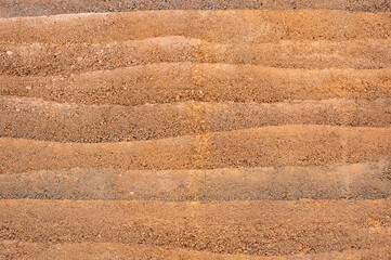 Full frame shot of an earthen wall texture of clay house structure.