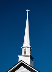 church steeple against blue sky - obrazy, fototapety, plakaty
