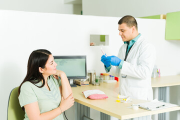 Smiling woman doing medical tests and exams in the lab