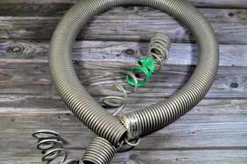 A broken flexible hose from a vacuum cleaner, substandard materials and maintenance services...