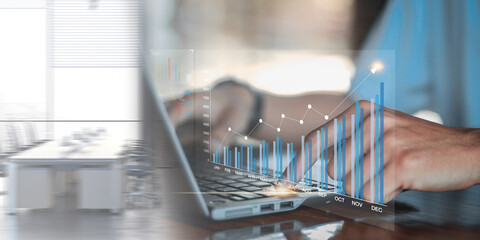 Data analyst working on business analytics dashboard with charts, with KPI and metrics connected to...